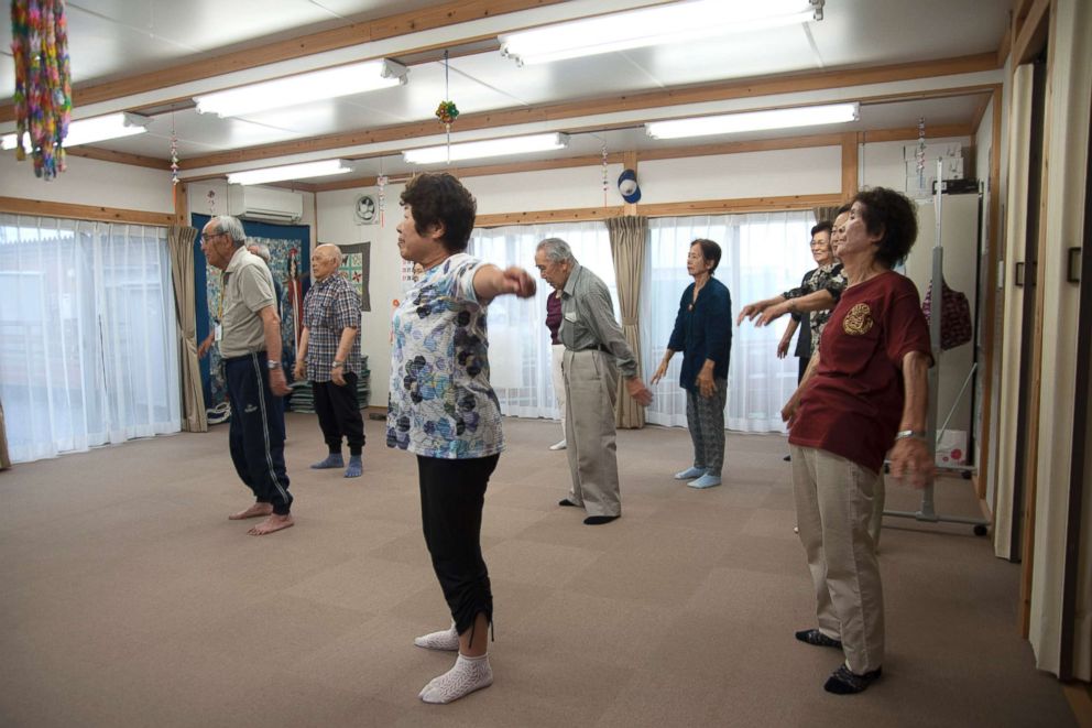 PHOTO: About a dozen senior residents participate in a morning workout at a community center of the Ushigoe Temporary Housing Complex in Minamisoma, Fukushima.