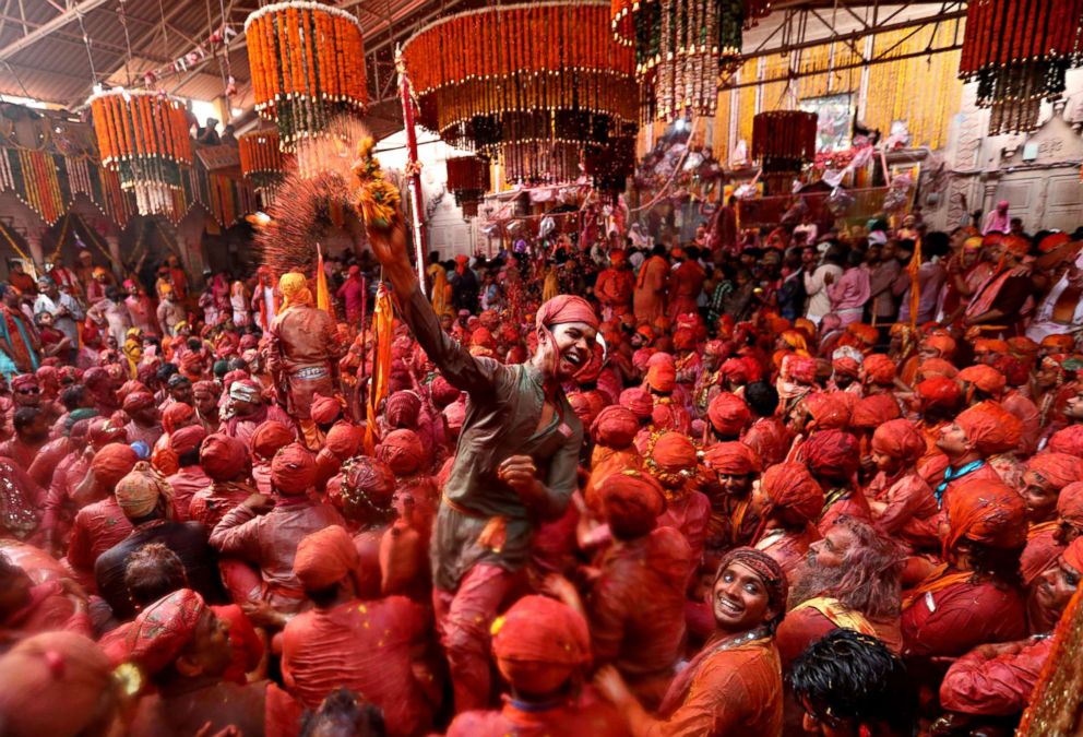 PHOTO: Hindu men from the villages of Nandgaon and Barsana celebrate the Lathmar Holi festival at the Radha Rani temple in Barsana village, Mathura, India, Feb. 24, 2018. 