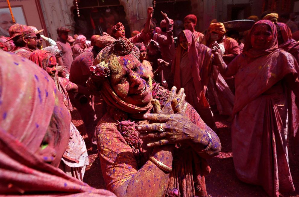 PHOTO: Widows covered in colors dance during Holi celebrations in the town of Vrindavan in the northern state of Uttar Pradesh, India, Feb. 27, 2018. 