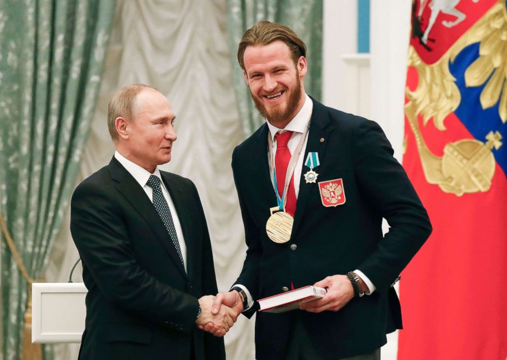 PHOTO: Russian President Vladimir Putin shakes hands with Russian ice hockey player and gold medalist of the 2018 Pyeongchang Winter Olympic Games Ivan Telegin during an award ceremony at the Kremlin in Moscow, Feb. 28, 2018.