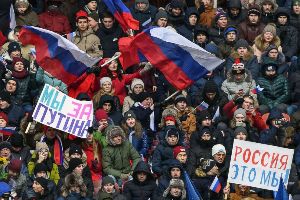PHOTO: Supporters of presidential candidate, President Vladimir Putin gather for a pre-election rally at the Luzhniki stadium in Moscow, March 3, 2018.