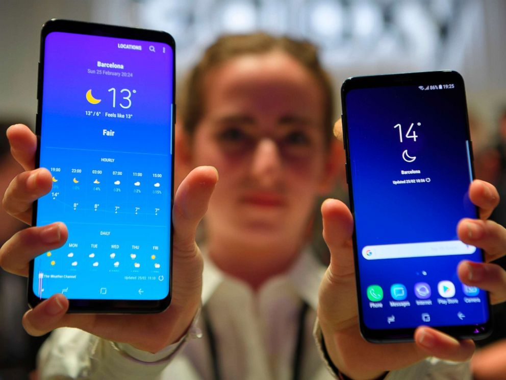 PHOTO: A hostess holds two new Samsung Galaxy S9 mobile phones during the Samsung Galaxy S9 Unpacked event on Feb. 25, 2018 in Barcelona.