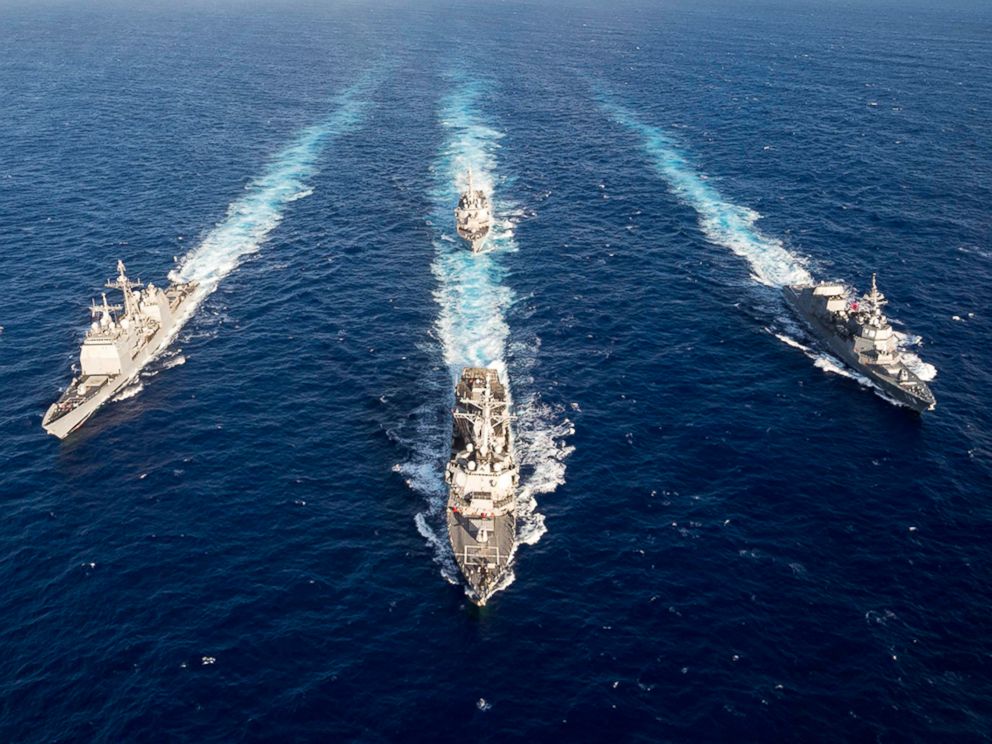 Guided-missile destroyer USS Mustin leads the guided-missile cruiser USS Antietam, USS Curtis Wilbur and the Japan Maritime Self-Defense Force ship JS Fuyuzuki in a formation for the completion of MultiSail 2018 on March 14, 2018, in the Philippine Sea. 