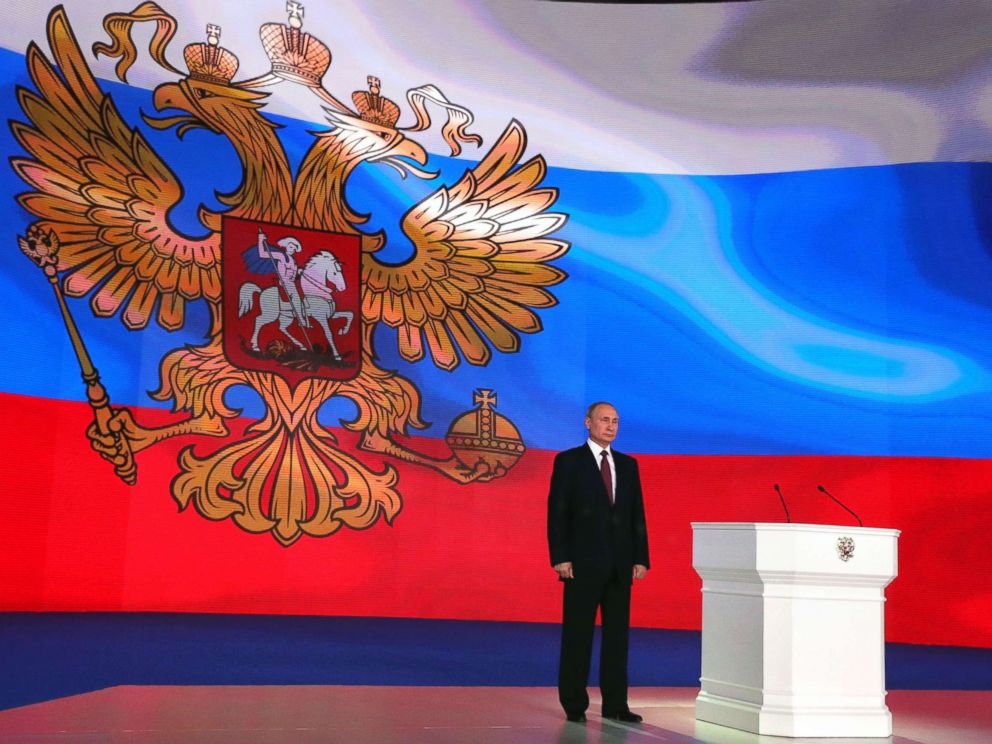 PHOTO: Russian President Vladimir Putin stands on the stage while addressing the Federal Assembly at Moscows Manezh exhibition centre, March 1, 2018.