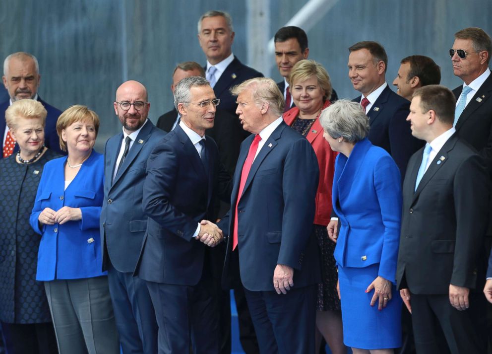 PHOTO: NATO Secretary General Jens Stoltenberg (center L) shakes hands with President Donald Trump during a NATO summit in Brussels, July 11, 2018.