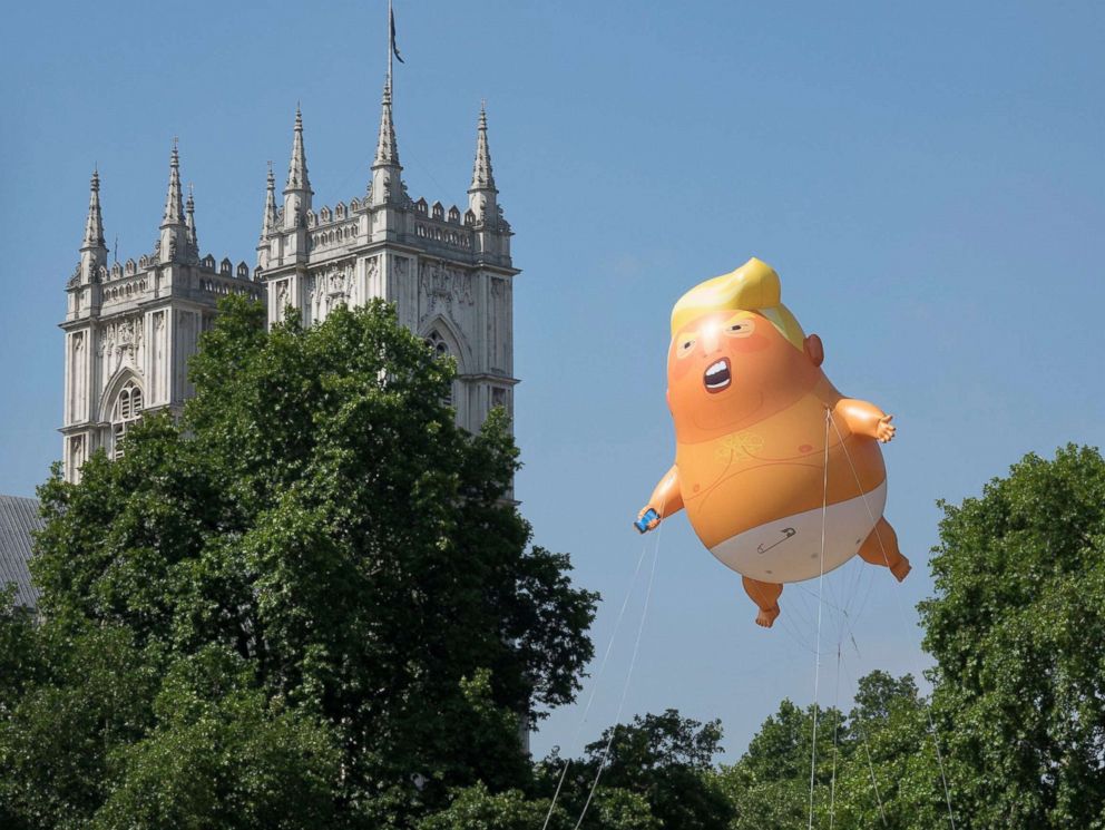 PHOTO: A giant inflatable balloon depicting President Trump as a baby in a nappy is flown over Parliament Square in London, July 13, 2018.